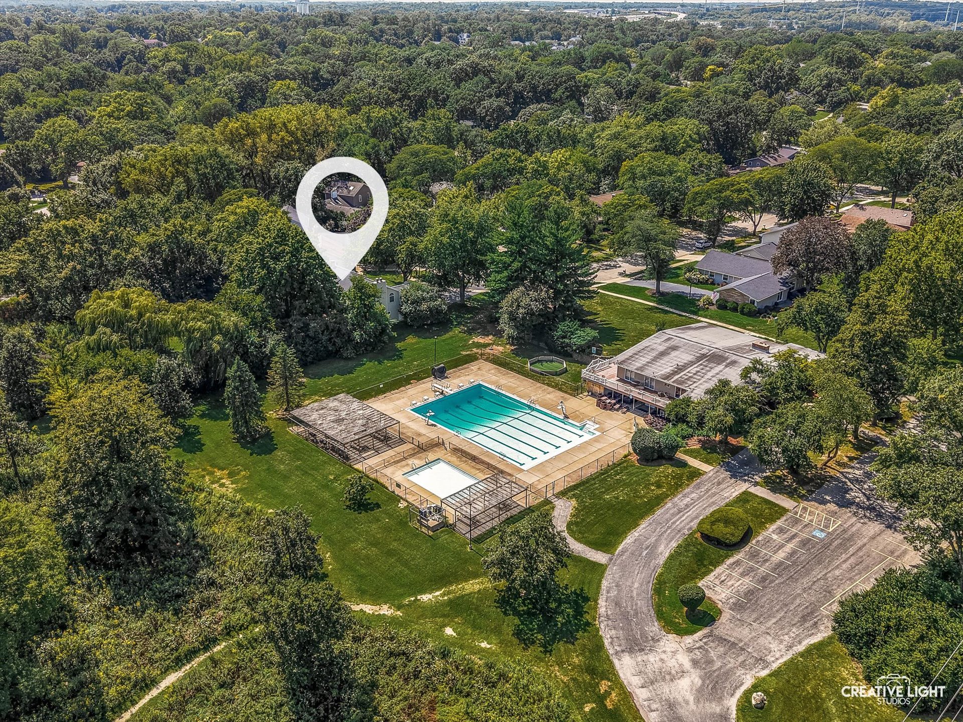 Drone aerial of 1101 Barberry Court Downers Grove highlighting home location near the Orchard Brook community pool and clubhouse.